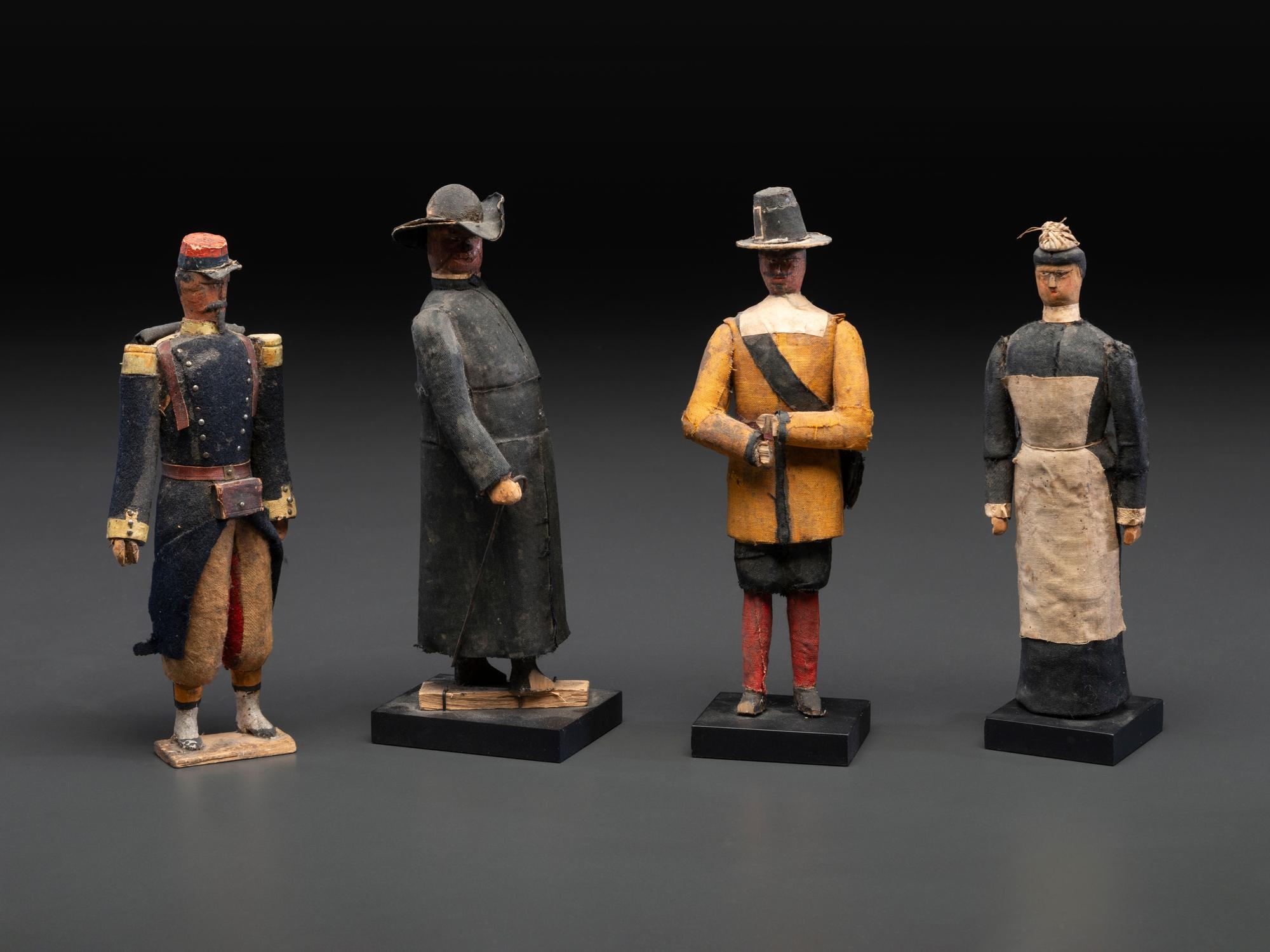 A Collection of Folk Art Carved and Painted 'English Parade' Figures