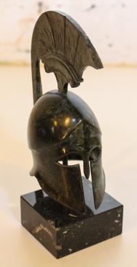 A Cast Metal Grecian Helmet. Height 6 1/4 inches.