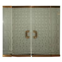 A Mid-Century Brass and Glass Entryway 72" W x 6" D x 96" H — United States, Mid-20th Century