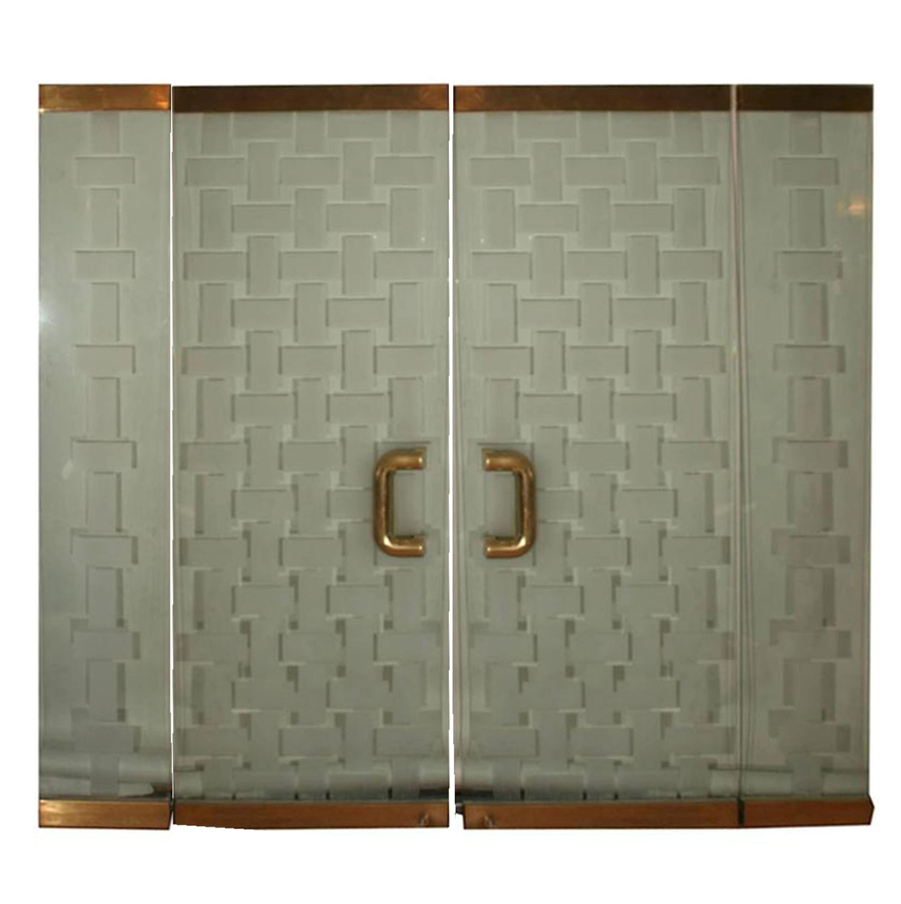 A Mid-Century Brass and Glass Entryway 72" W x 6" D x 96" H — United States, Mid-20th Century