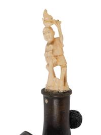 A Chinese Silk Iron with a Figural Handle