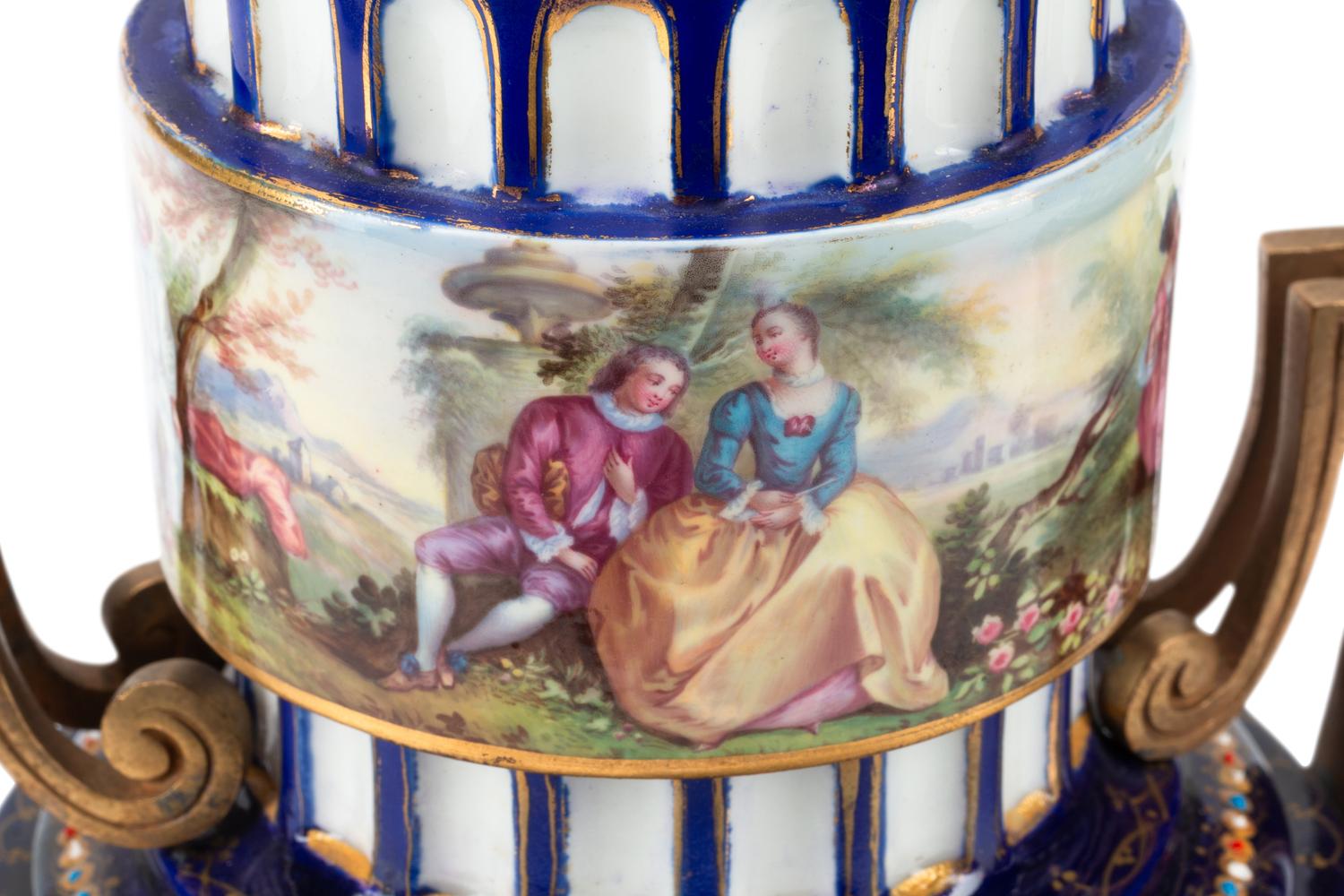 A Pair of Gilt Bronze Mounted Sèvres Style Porcelain Urns