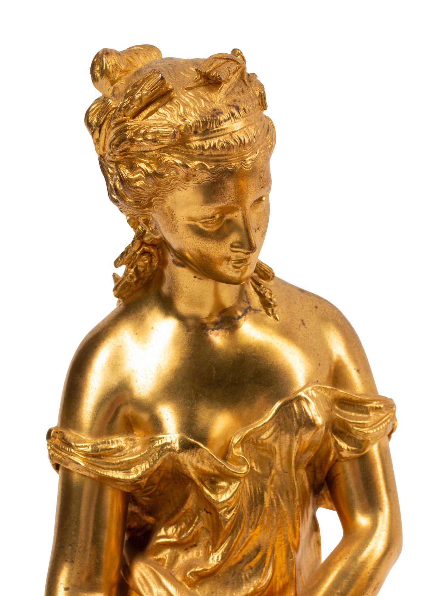 Theodore Doriot (French, 19th Century) Allegorical Figures (a pair) gilt bronze signed T. Doriot Height overall 16 inches.