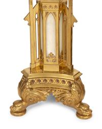 A Pair of Gothic Style Brass and Inset Glass Candlesticks