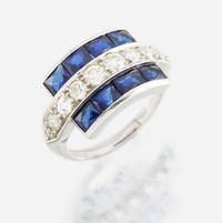 A diamond, blue glass, and platinum ring