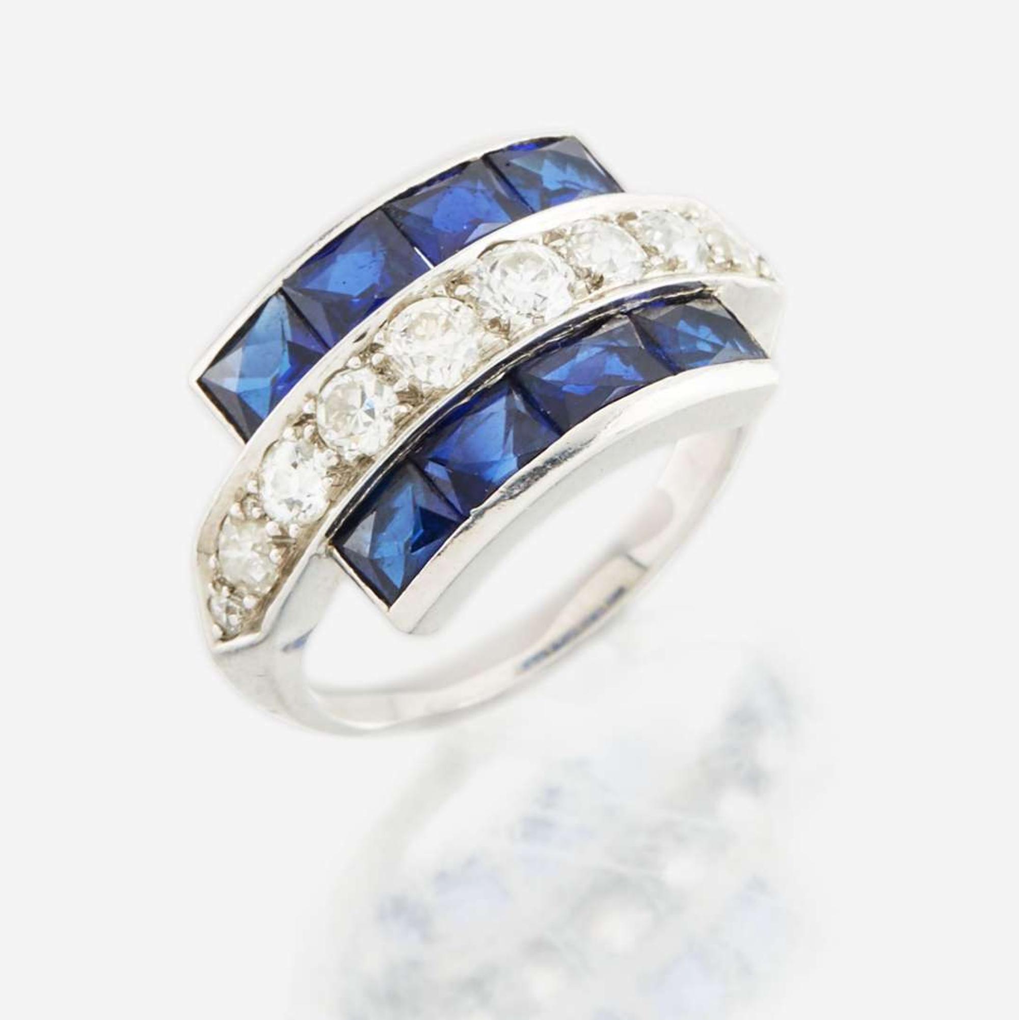 A diamond, blue glass, and platinum ring