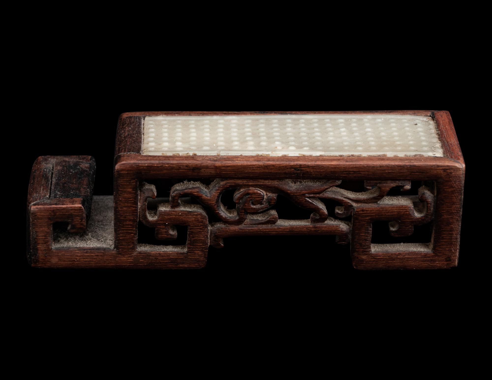 A Chinese Celadon Jade Sword Fitting Mounted as Ink-Cake Stand