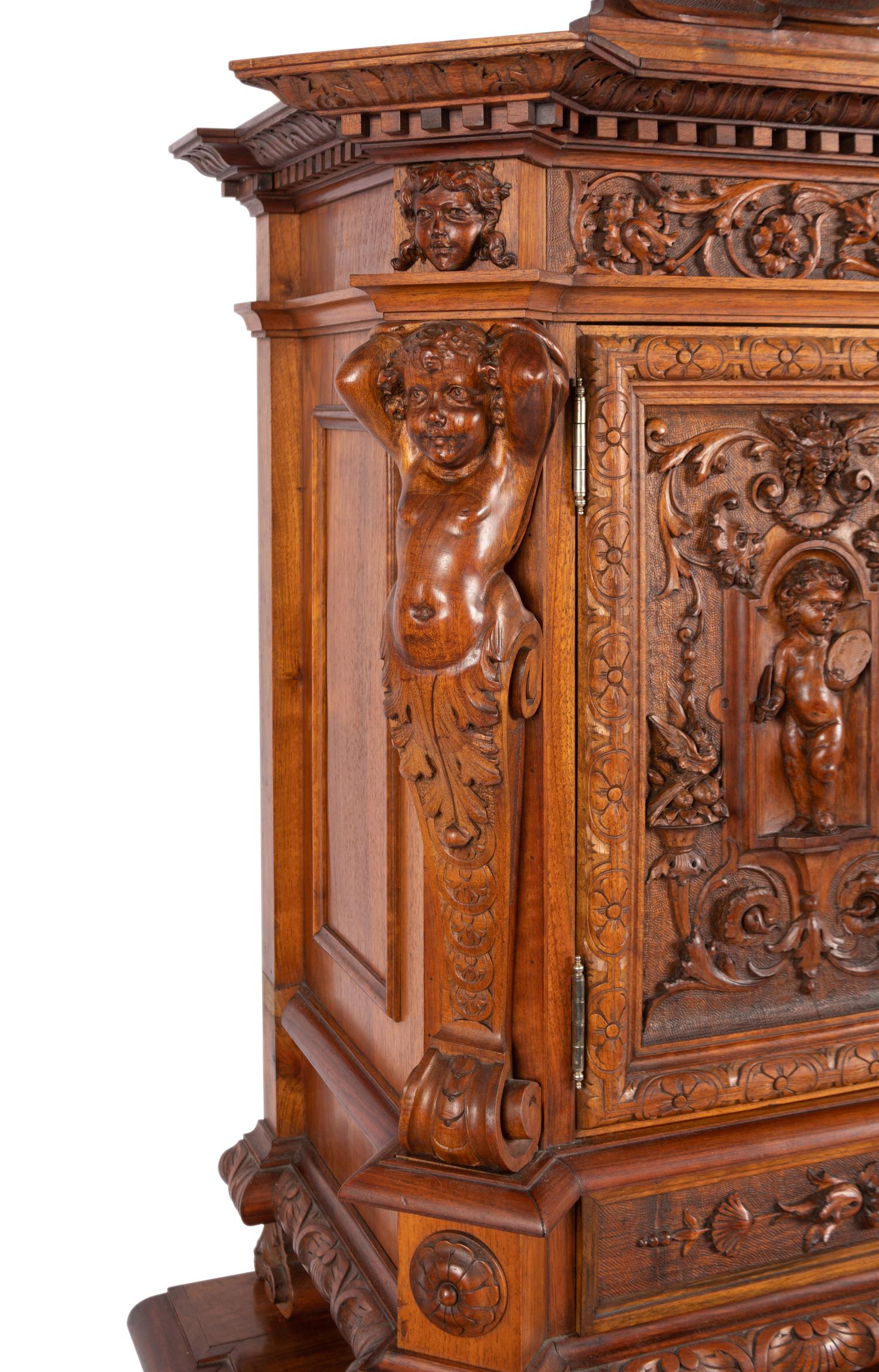 A Renaissance Revival Carved Walnut Cabinet In the Manner of Alexander Roux