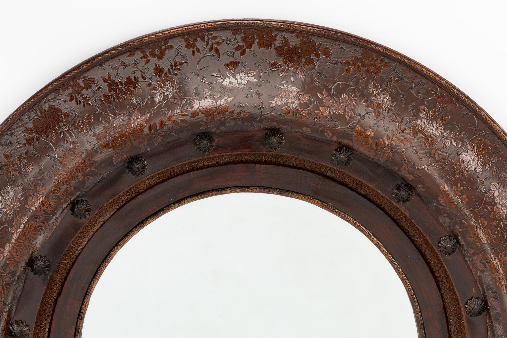 A Pair of Portuguese Embossed Leather Circular Mirrors