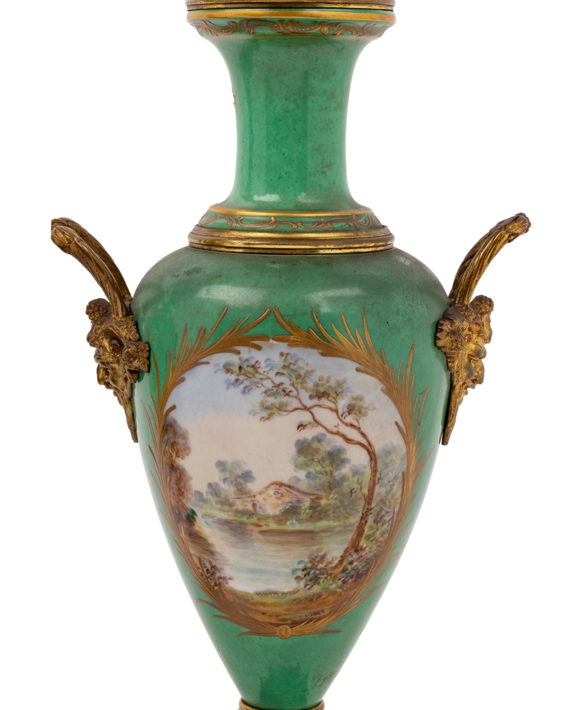 A Pair of Sèvres Style Gilt Metal Mounted Porcelain Urns