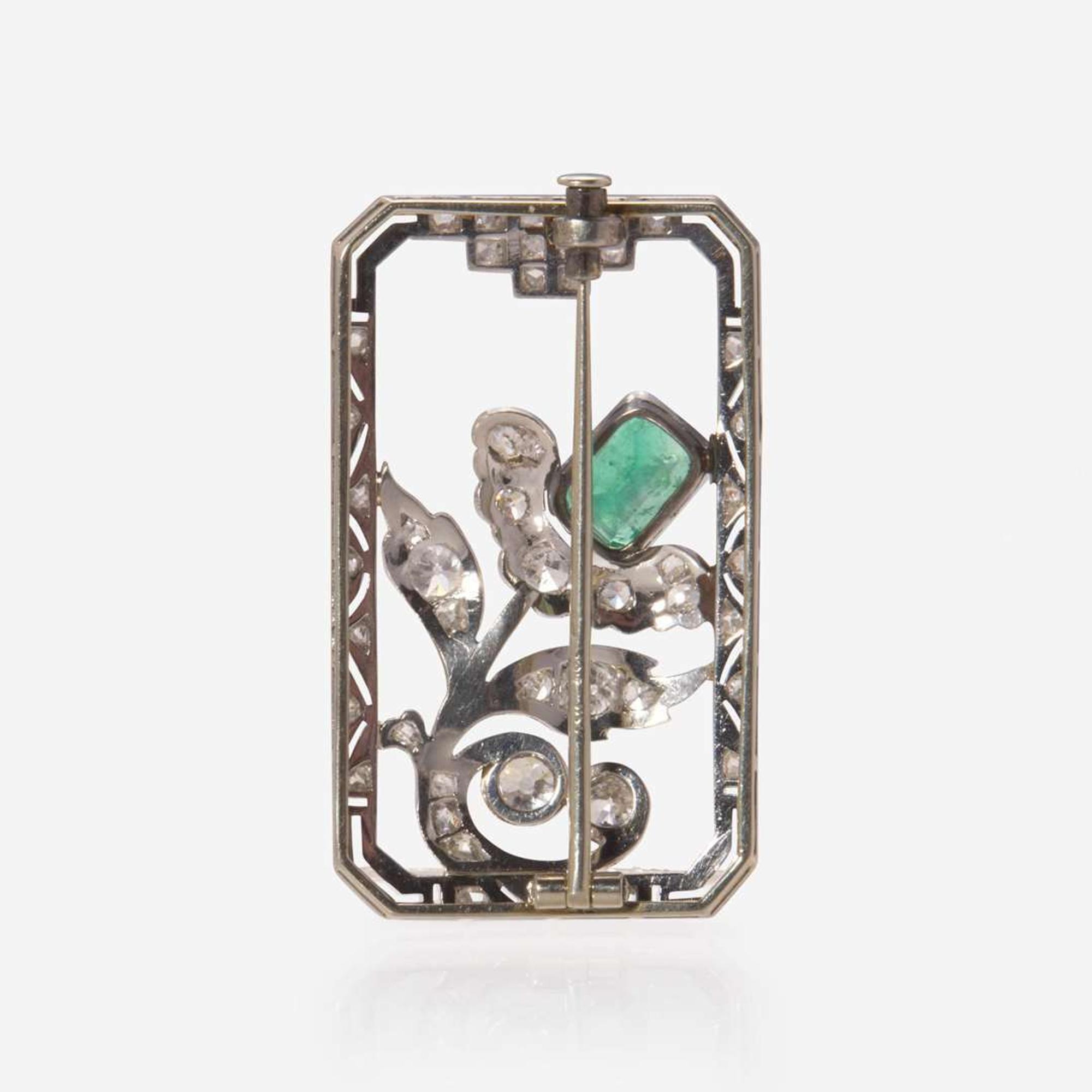 An 18K White Gold, Diamond, and Emerald Brooch