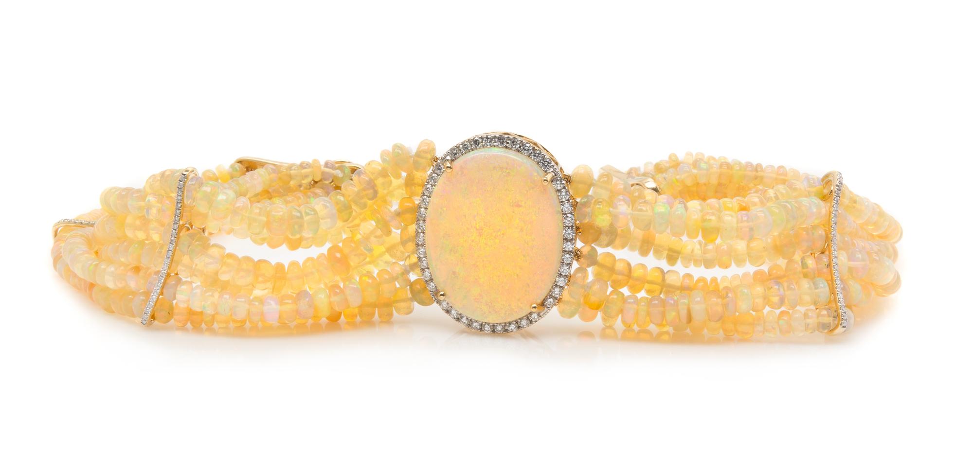 A Collection of Yellow Gold, Opal and Diamond Jewelry, 49.60 dwts.