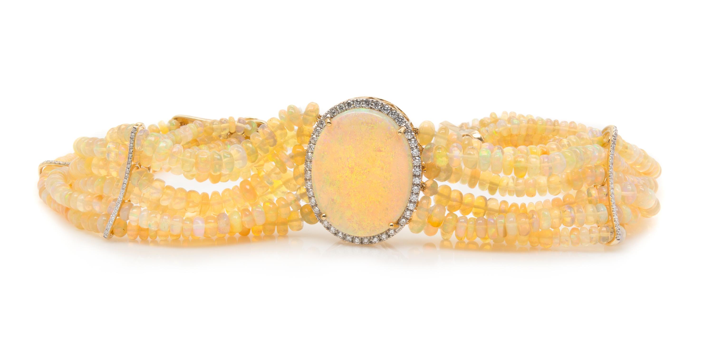 A Collection of Yellow Gold, Opal and Diamond Jewelry, 49.60 dwts.