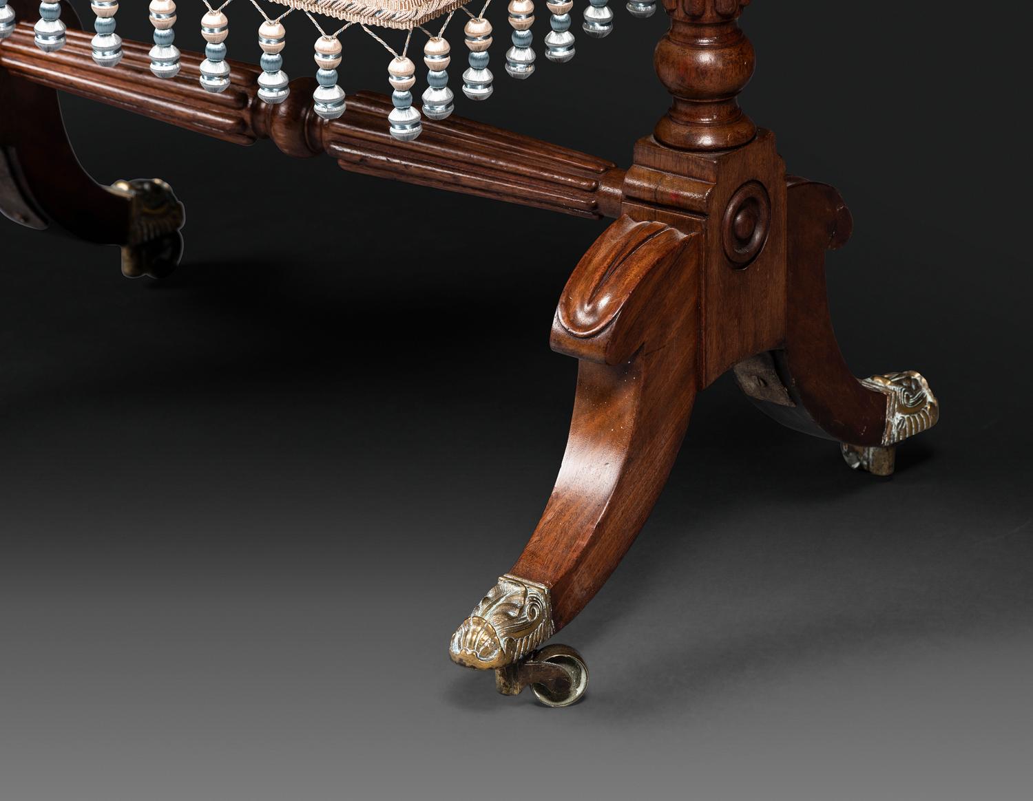 A Classical Figured Mahogany and Rosewood Veneered Sewing Table