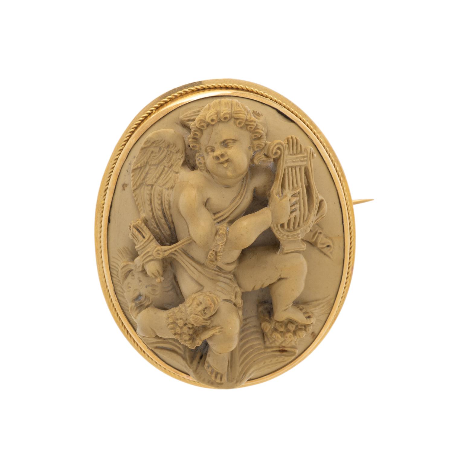 LAVA CAMEO AND YELLOW GOLD BROOCH