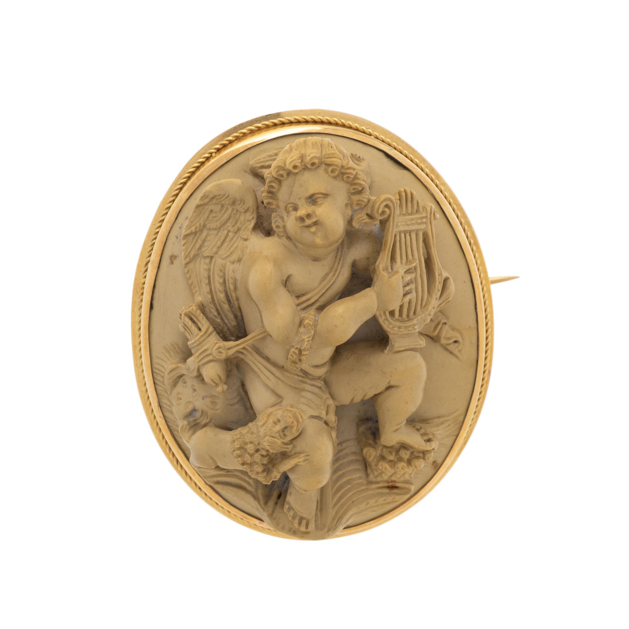 LAVA CAMEO AND YELLOW GOLD BROOCH
