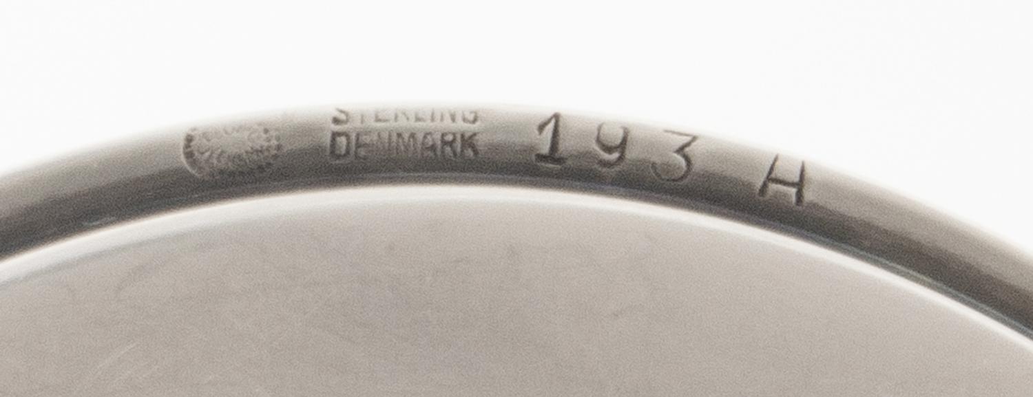 A Set of Twenty-Four Danish Silver Coasters, Georg Jensen, Copenhagen, Most 1945-77, no. 193A, circular with raised edge, center chased