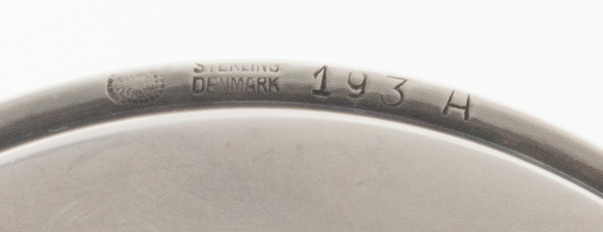 A Set of Twenty-Four Danish Silver Coasters, Georg Jensen, Copenhagen, Most 1945-77, no. 193A, circular with raised edge, center chased