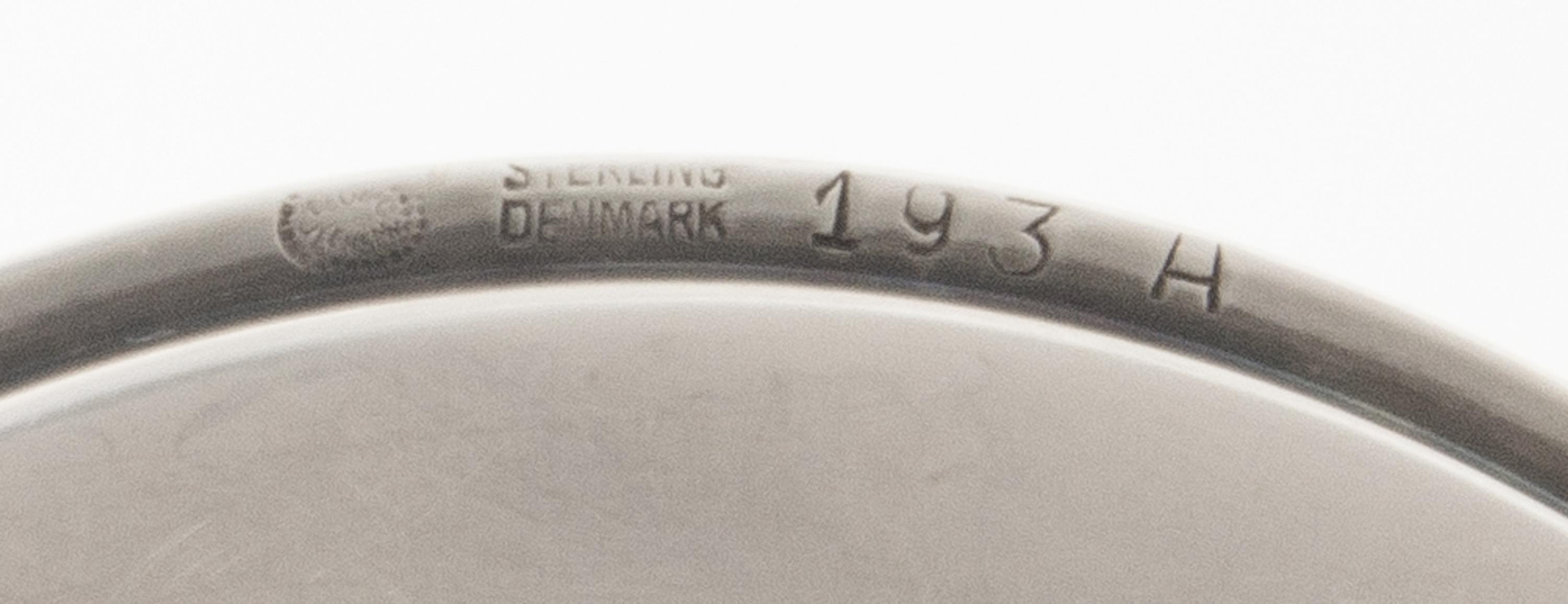 A Set of Twenty-Four Danish Silver Coasters, Georg Jensen, Copenhagen, Most 1945-77, no. 193A, circular with raised edge, center chased