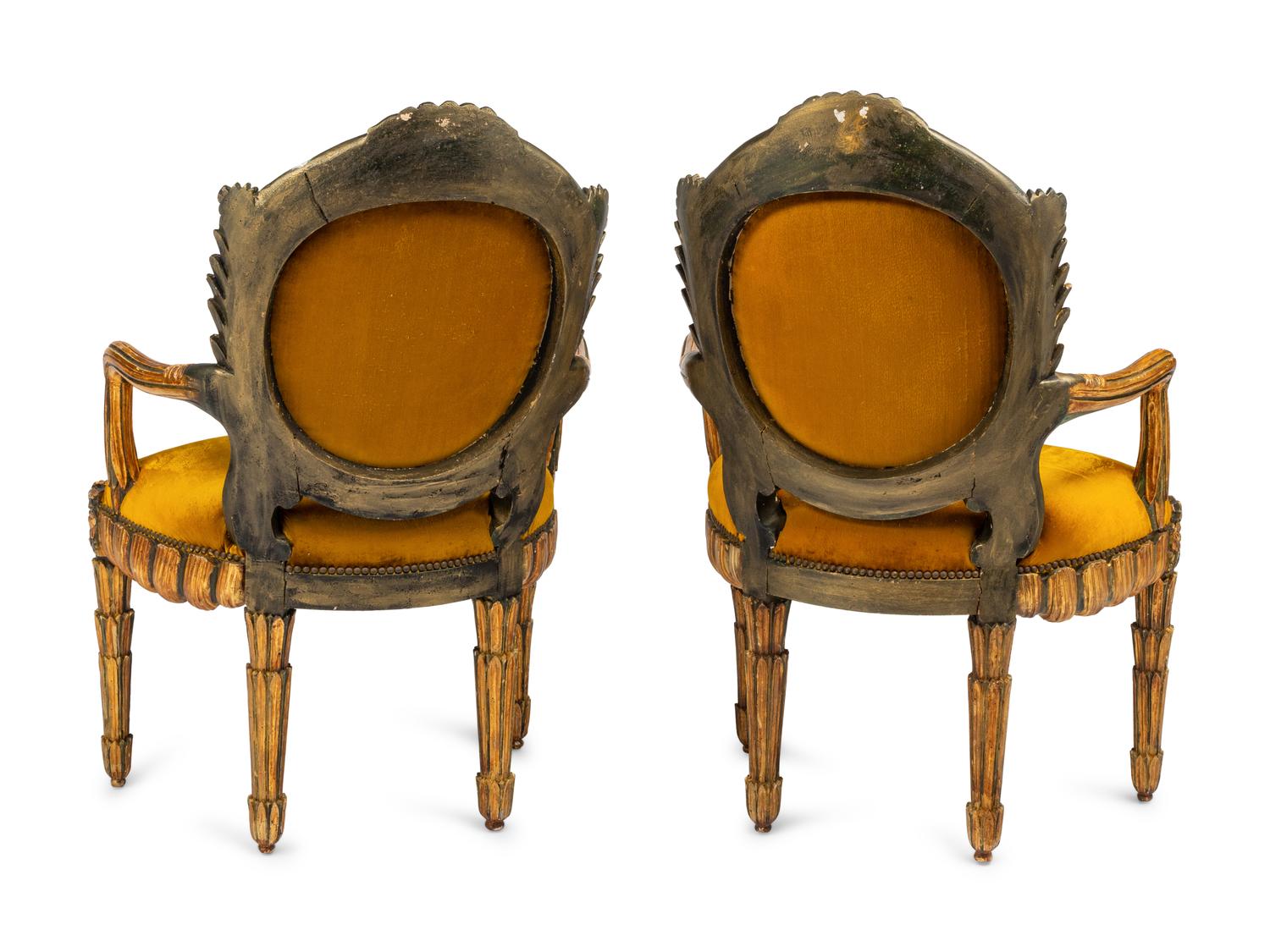 A Pair of Italian Grotto Style Painted and Parcel Gilt Armchairs