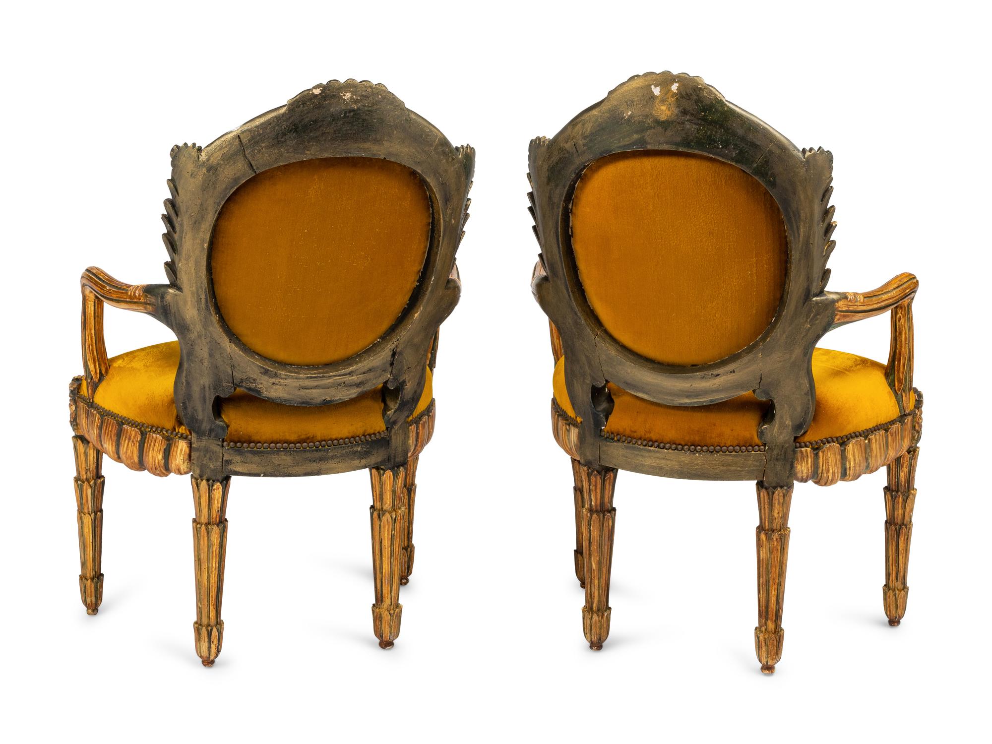 A Pair of Italian Grotto Style Painted and Parcel Gilt Armchairs