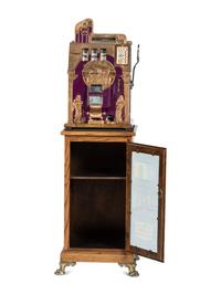 A Mills 5 Cent Special Gold Roman Head Slot Machine on Reverse Printed Glass Inset Golden Nugget Stand