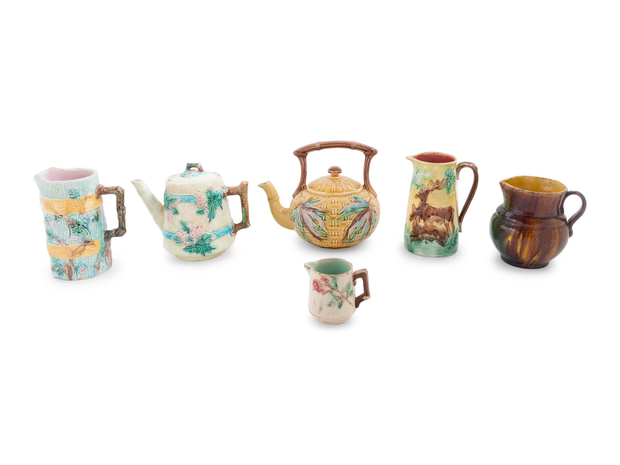 A Group of Eleven Majolica Pitchers, Teapots and Lidded Vessels