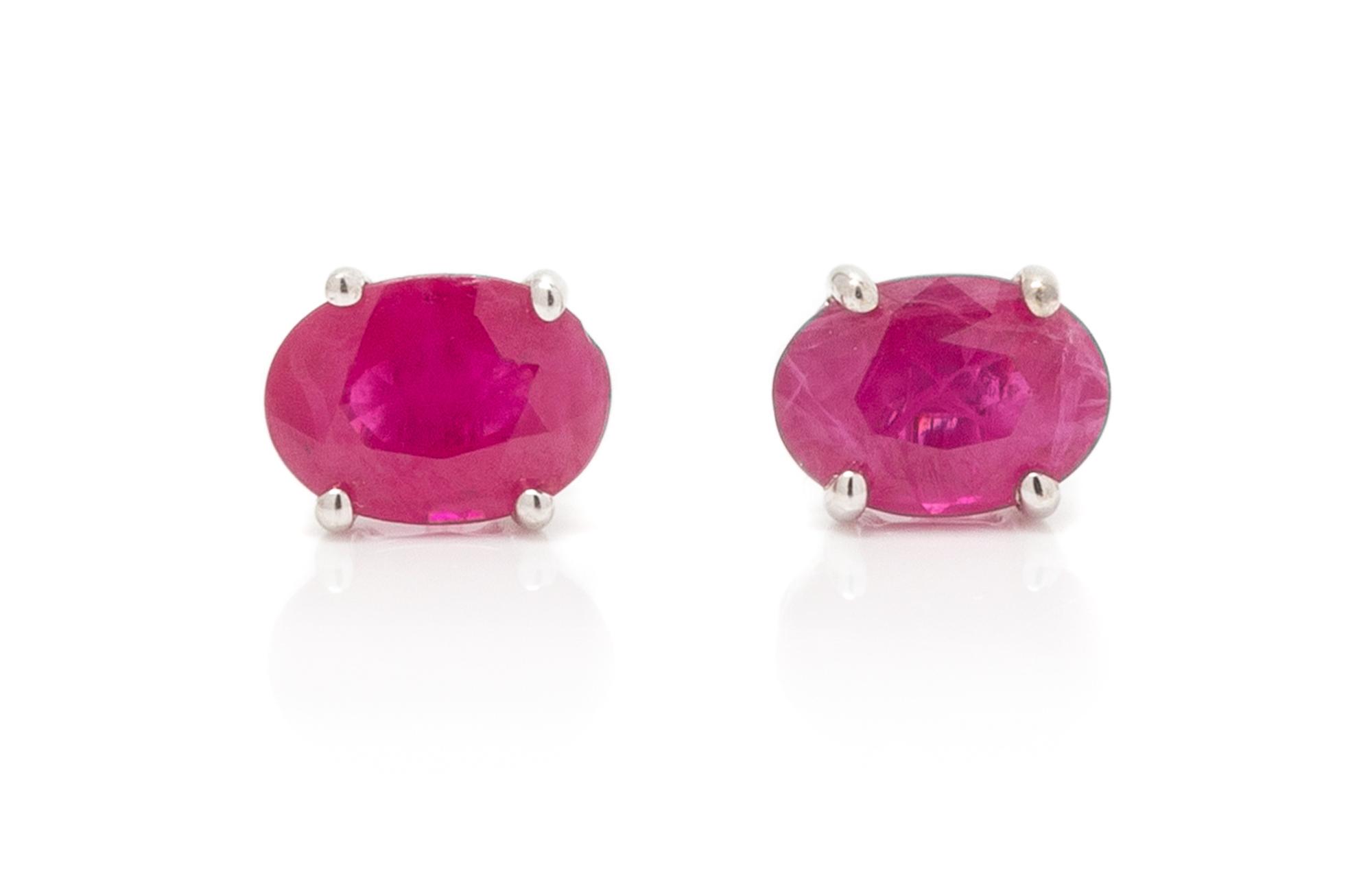 A Pair of White Gold and Ruby Stud Earrings, 0.80 dwts.