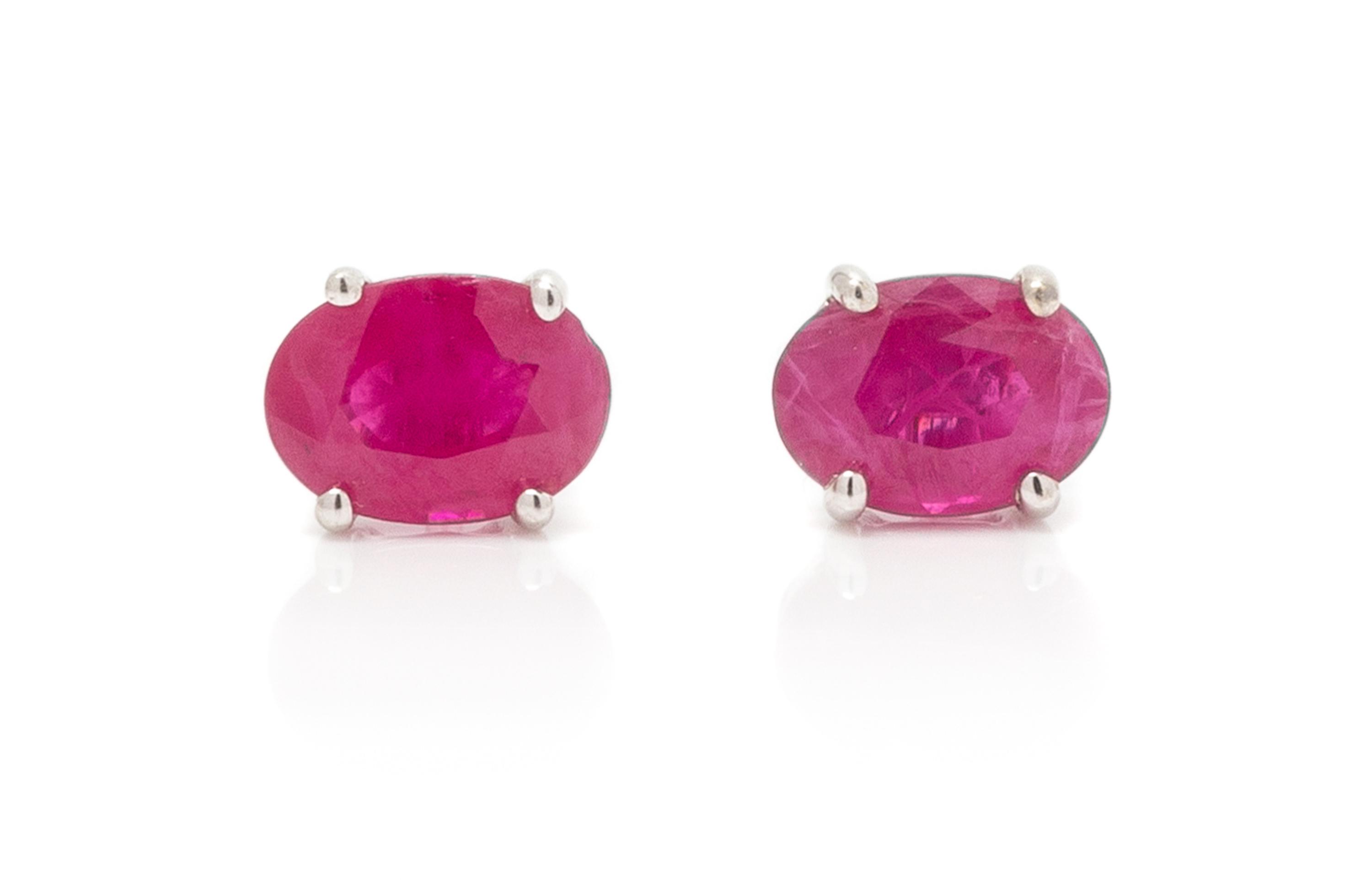A Pair of White Gold and Ruby Stud Earrings, 0.80 dwts.