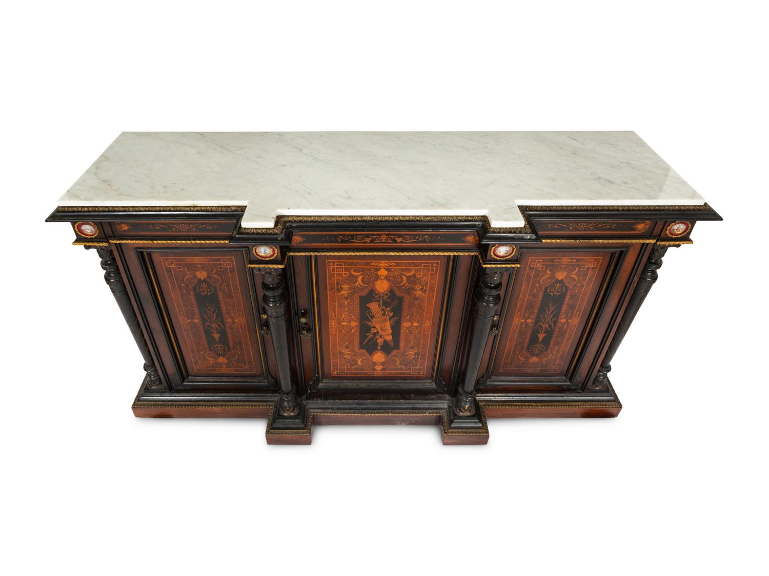 A Victorian Renaissance Revival Marquetry Inlaid and Parcel Ebonized Credenza in the Manner of Herter Brothers