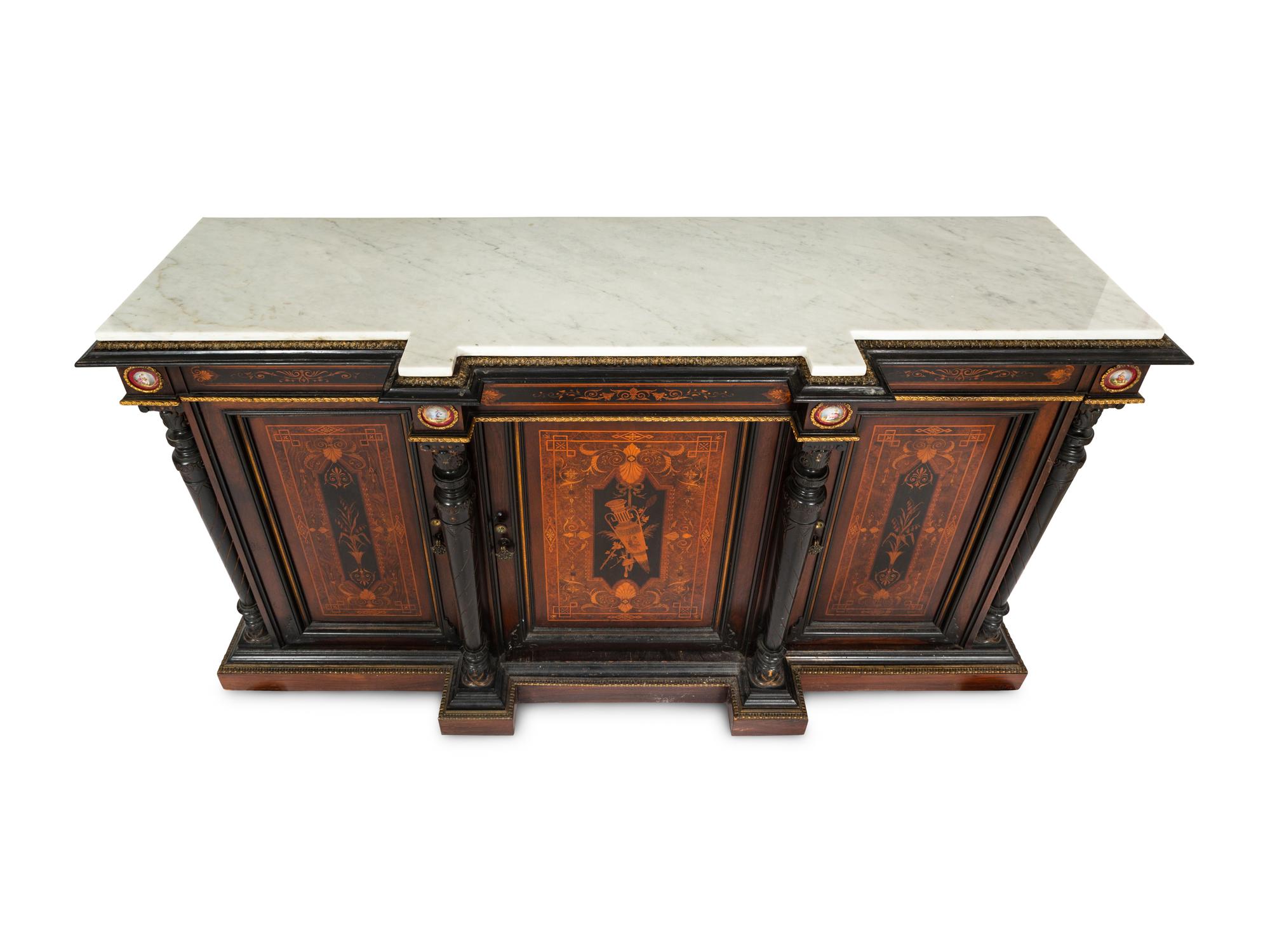 A Victorian Renaissance Revival Marquetry Inlaid and Parcel Ebonized Credenza in the Manner of Herter Brothers