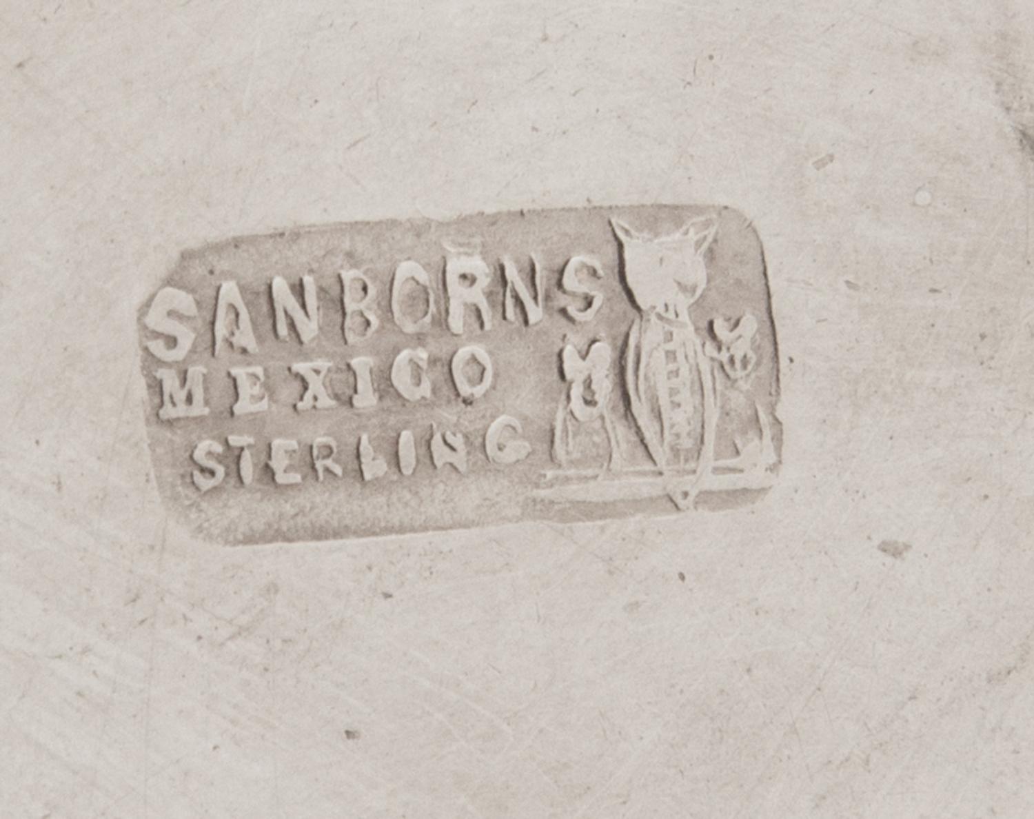 A Mexican Silver Ice Bucket, Sanborns, Mexico City, 20th Century, the tapering body with twin handles and a repousee band of rosettes.
