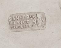 A Mexican Silver Ice Bucket, Sanborns, Mexico City, 20th Century, the tapering body with twin handles and a repousee band of rosettes.