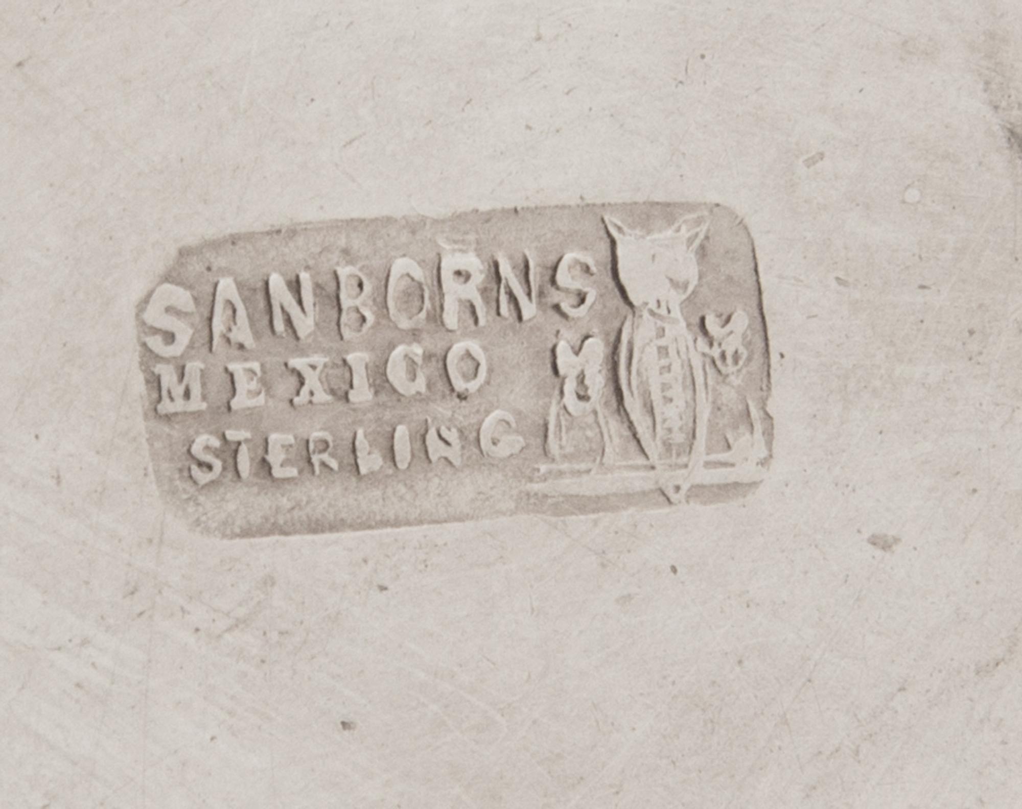 A Mexican Silver Ice Bucket, Sanborns, Mexico City, 20th Century, the tapering body with twin handles and a repousee band of rosettes.