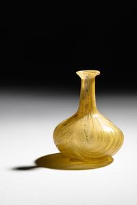 A Roman Marbled Yellow Glass Bottle