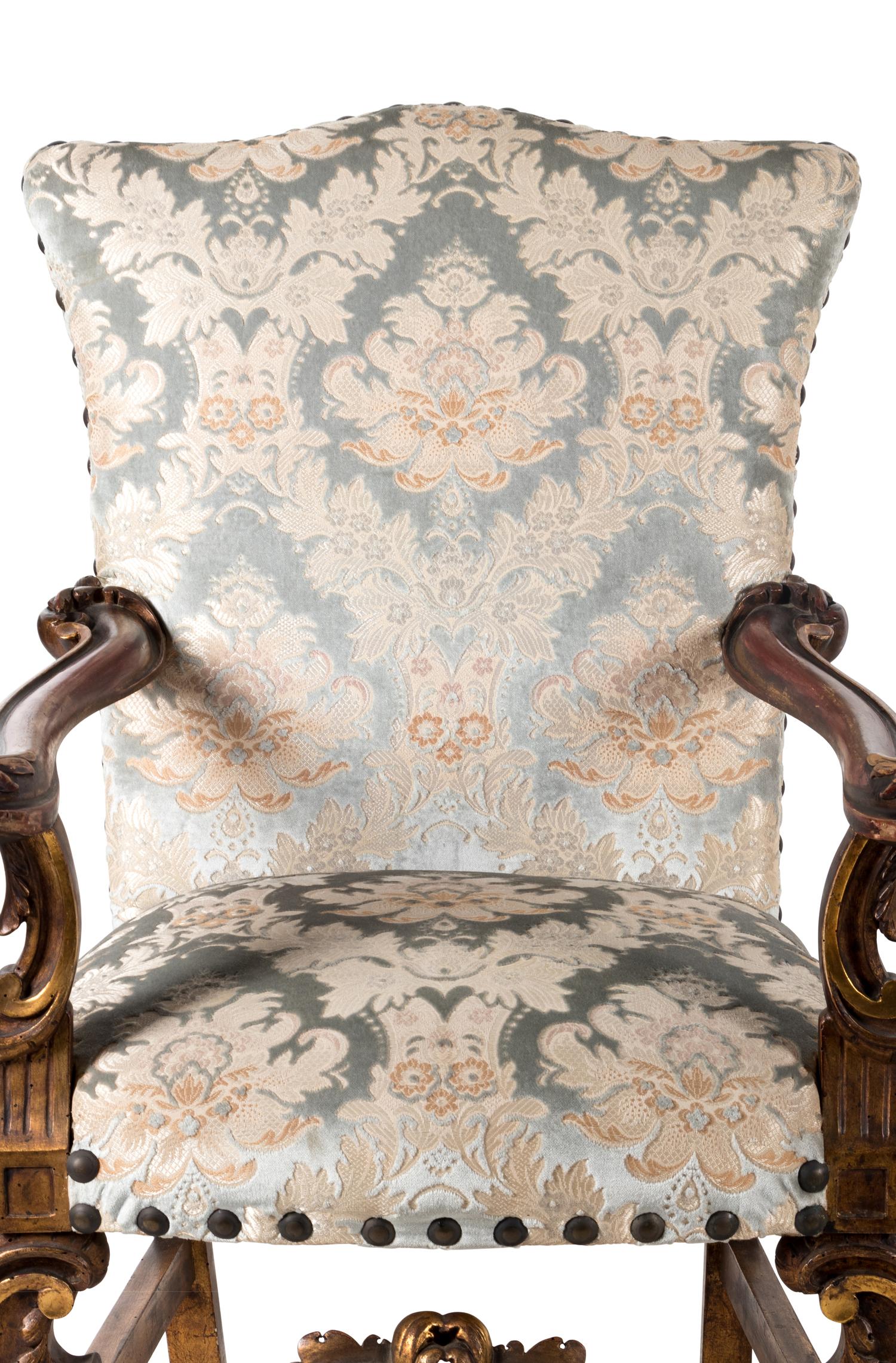 A Pair of Italian Baroque Style Parcel Gilt Walnut Armchairs