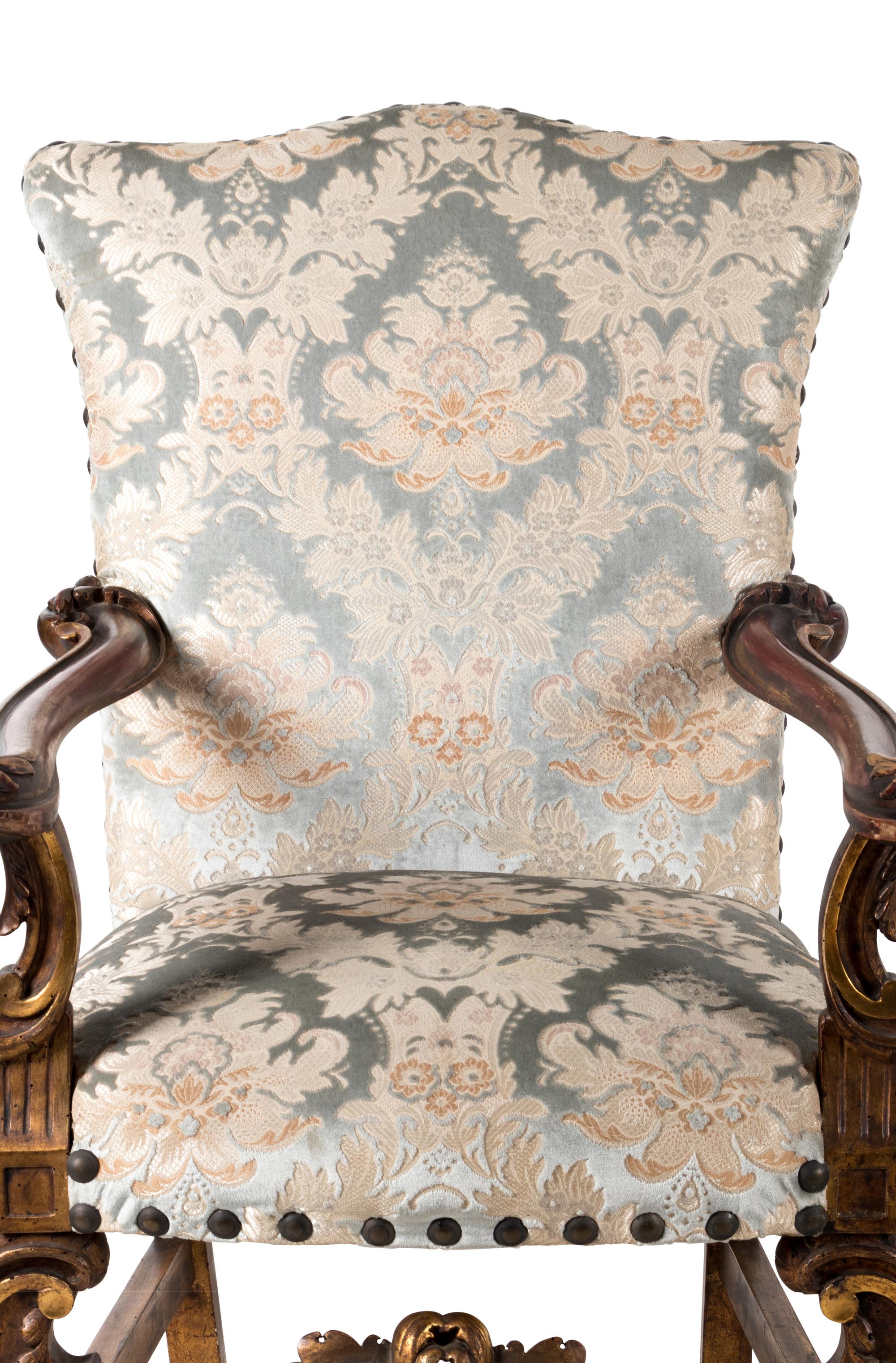 A Pair of Italian Baroque Style Parcel Gilt Walnut Armchairs