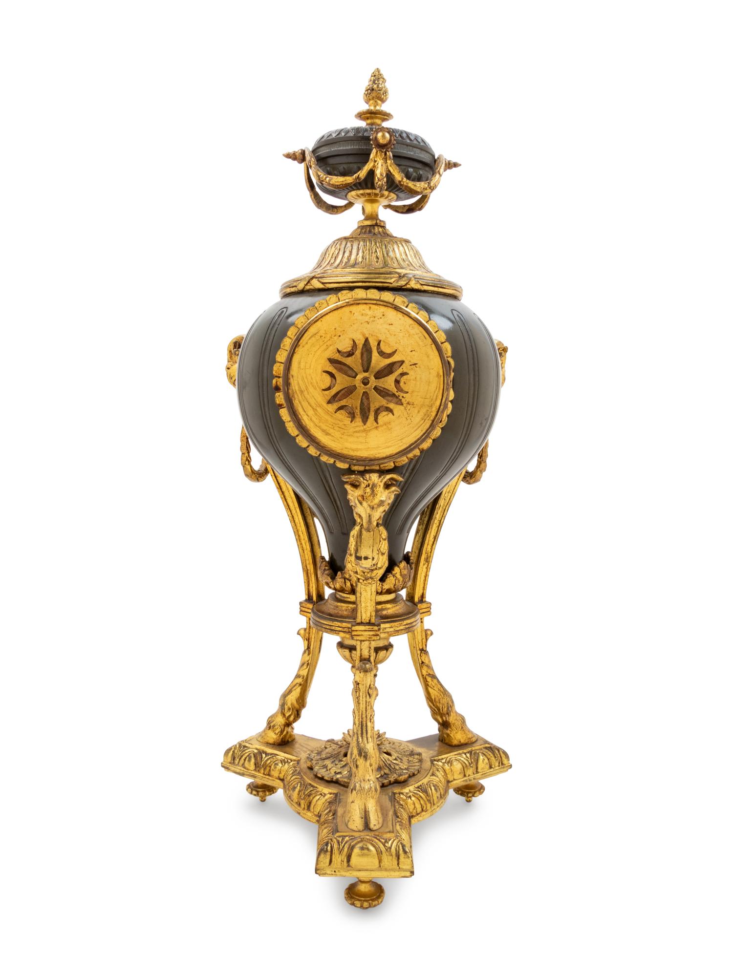 A French Gilt and Patinated Cast Metal Table Clock