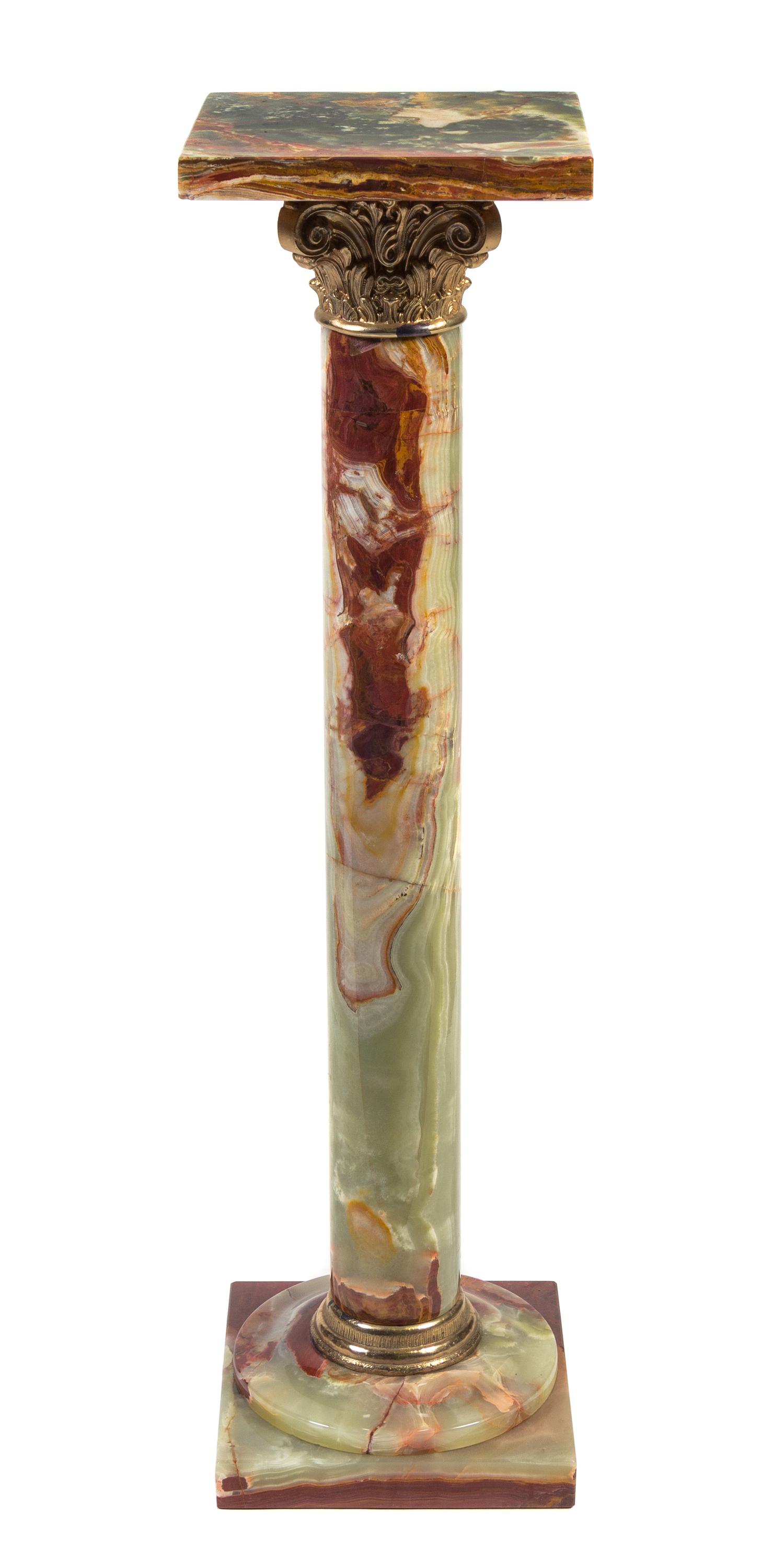 A Pair of Continental Gilt Metal Mounted Onyx Pedestals Height 37 inches.