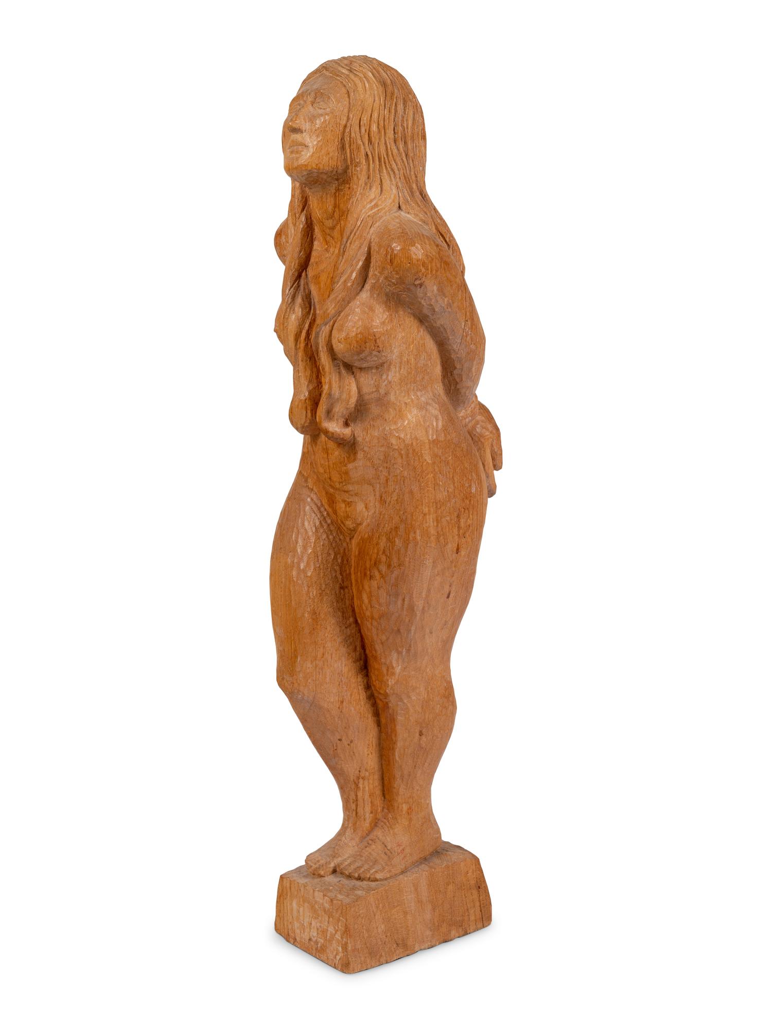 A Carved Oak Figure of a Bound Woman
