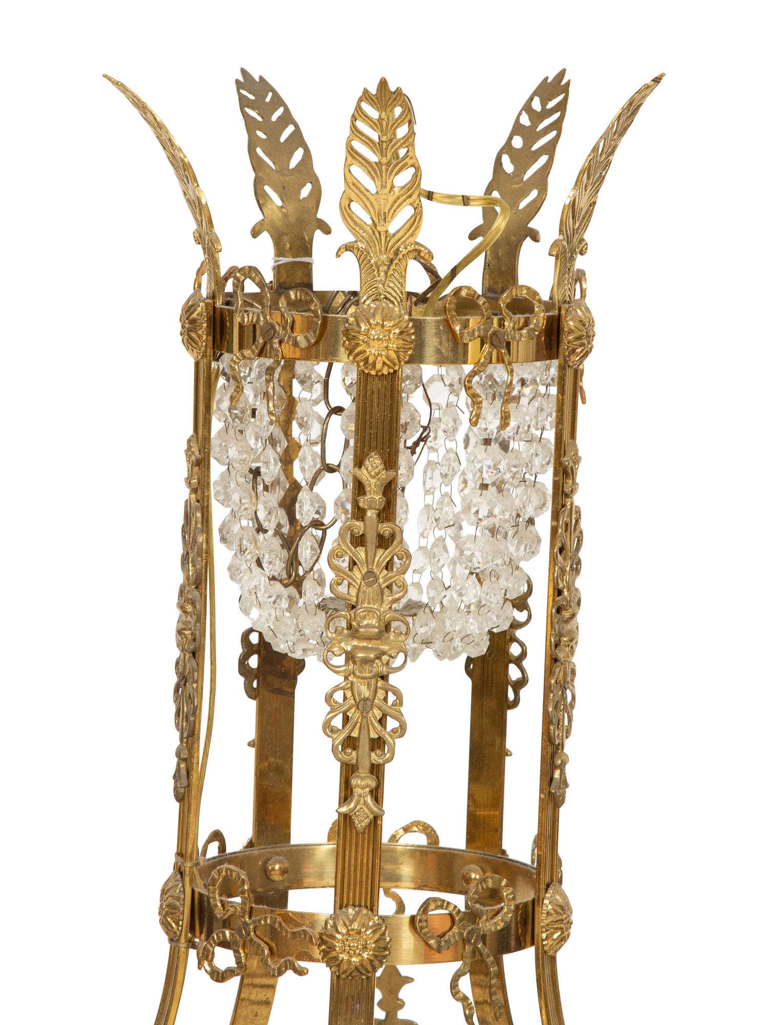 An Empire Style Gilt Metal and Cut Glass Ten-Light Chandelier