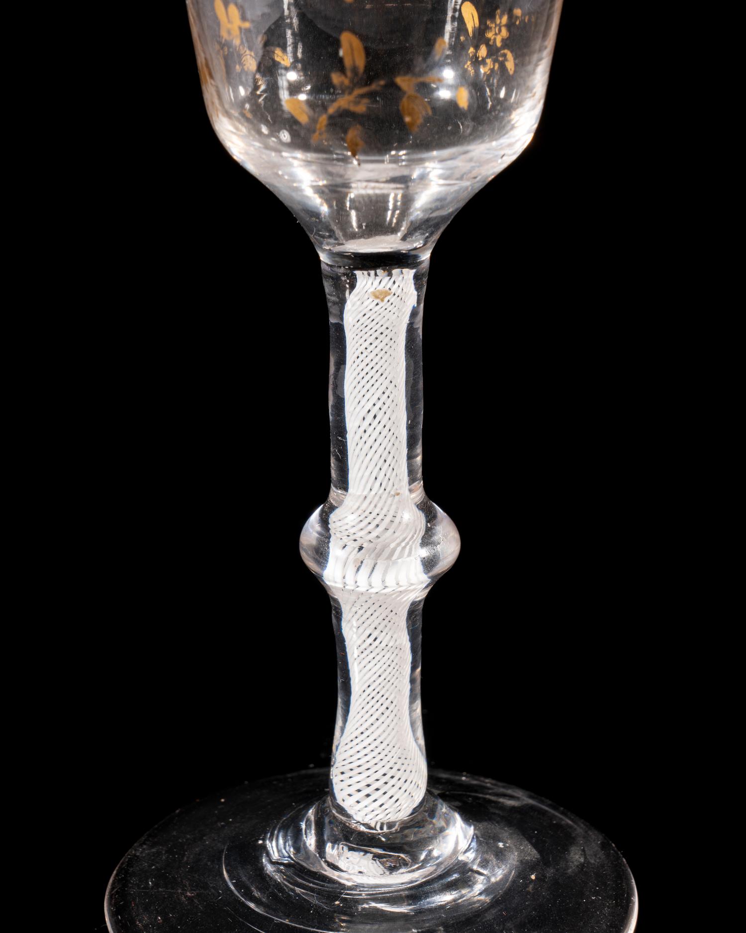A Giles Gilt Decorated Opaque Twist Knopped Wine Glass