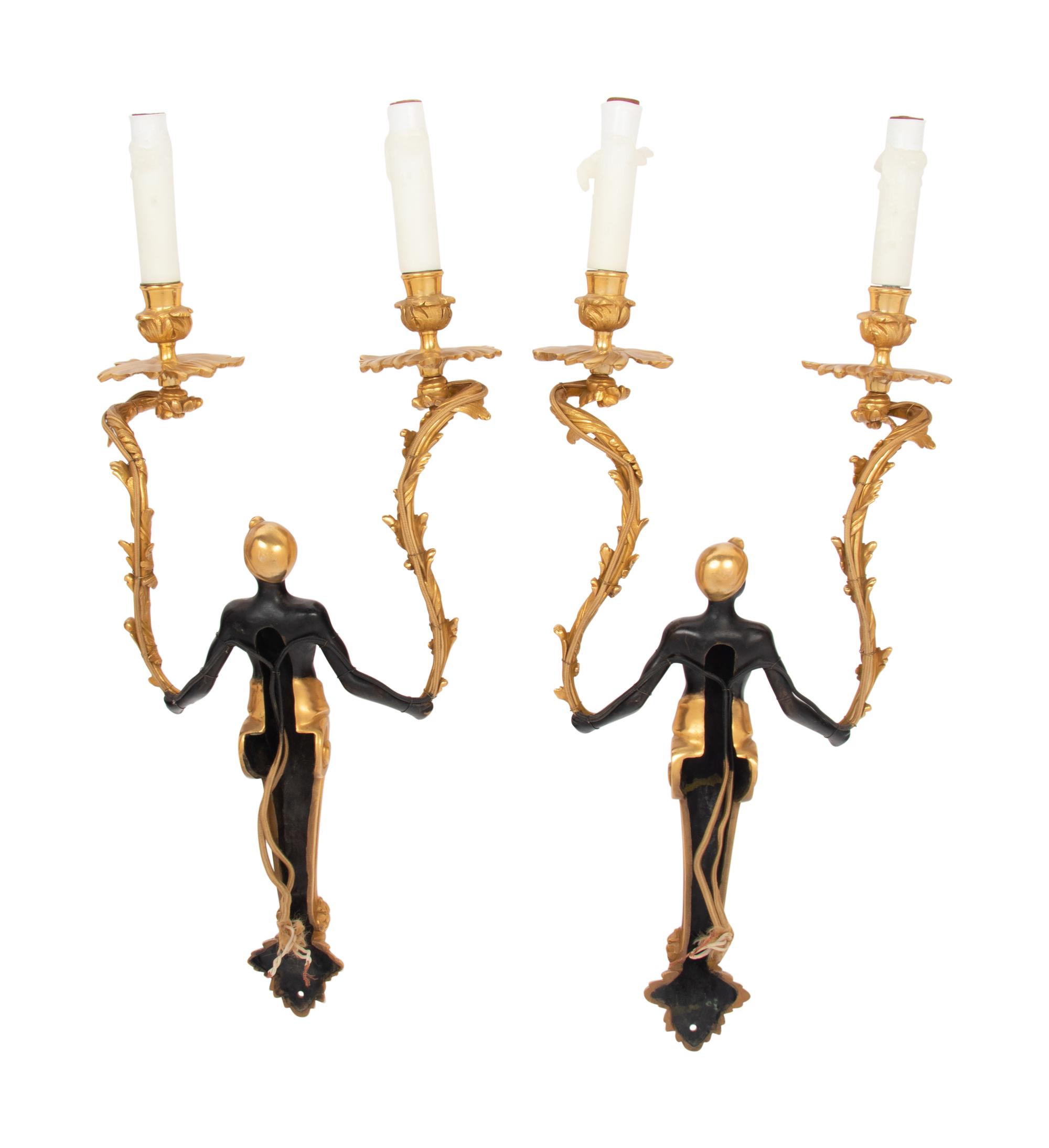 A Pair of French Gilt and Patinated Bronze Figural Two-Light Sconces