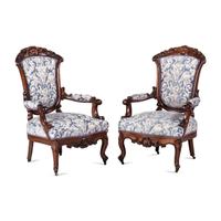 A Pair of Renaissance Revival Carved Walnut Fauteuils