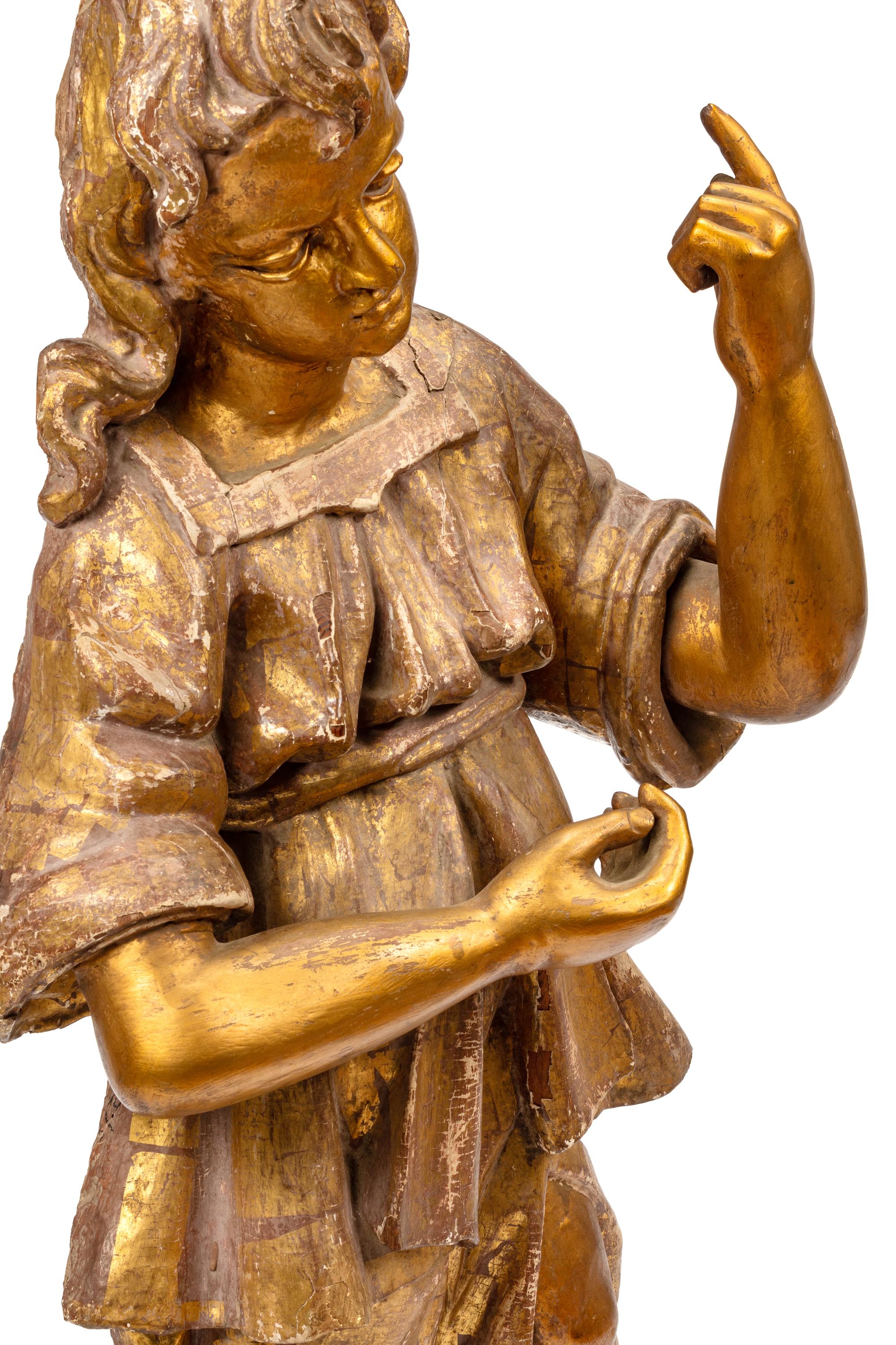 An Italian Carved and Parcel Gilt Saint Figure