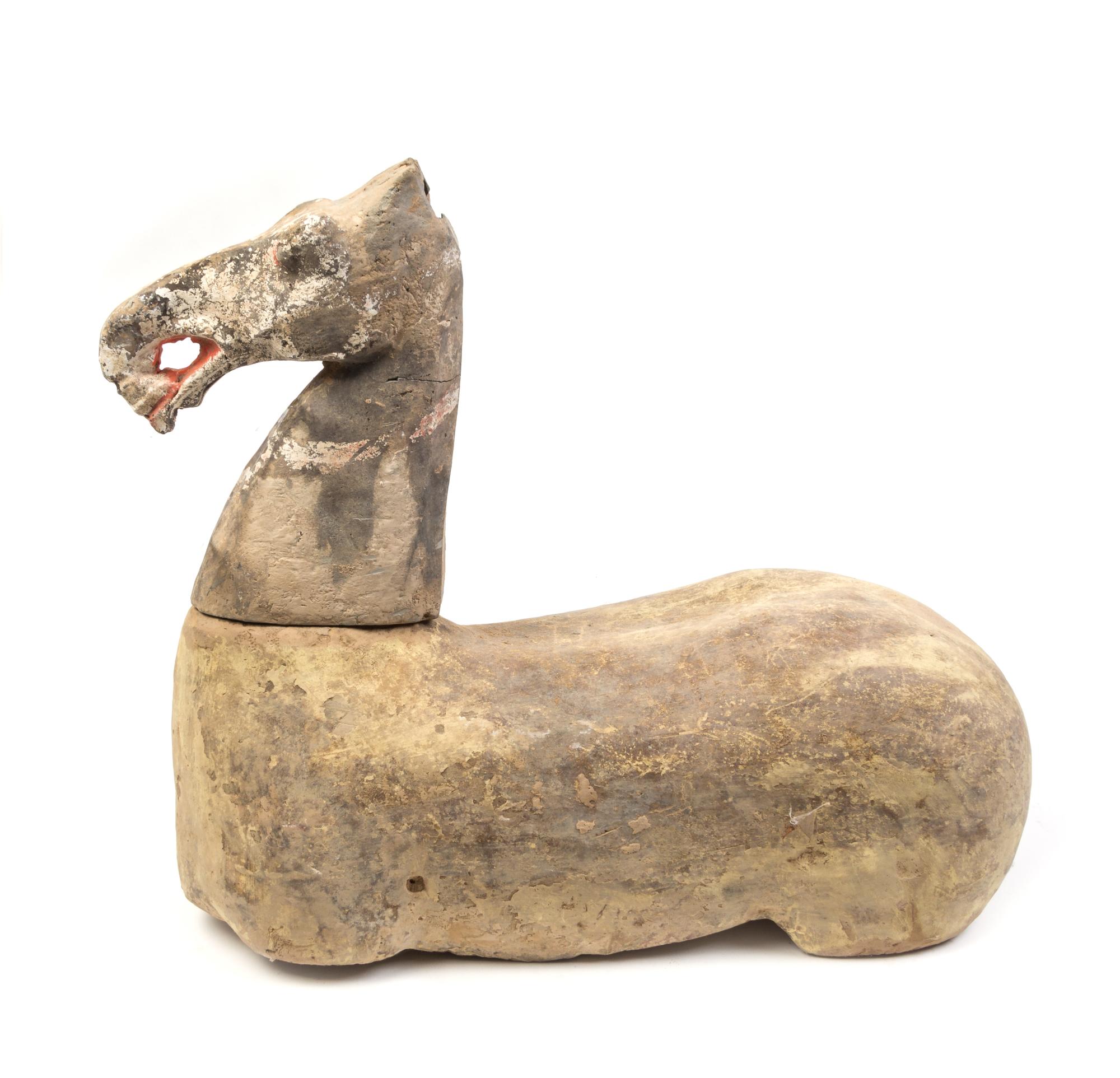 A Chinese Pottery Figure of a Horse Length 19 inches. — HAN DYNASTY