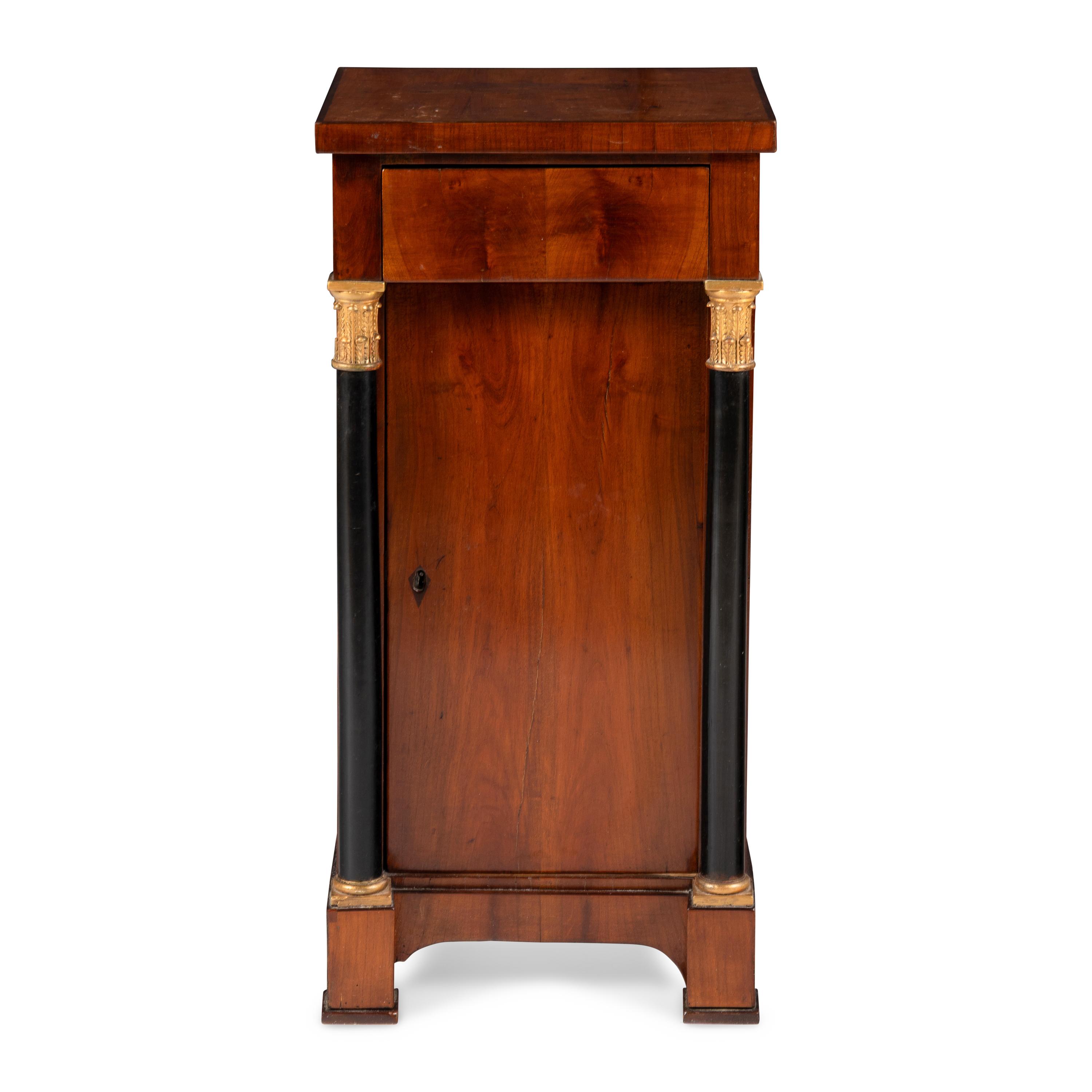 An Austrian Neoclassical Fruitwood, Ebonized and Parcel Gilt Side Cabinet
