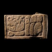 A Maya Limestone Panel with Glyphs