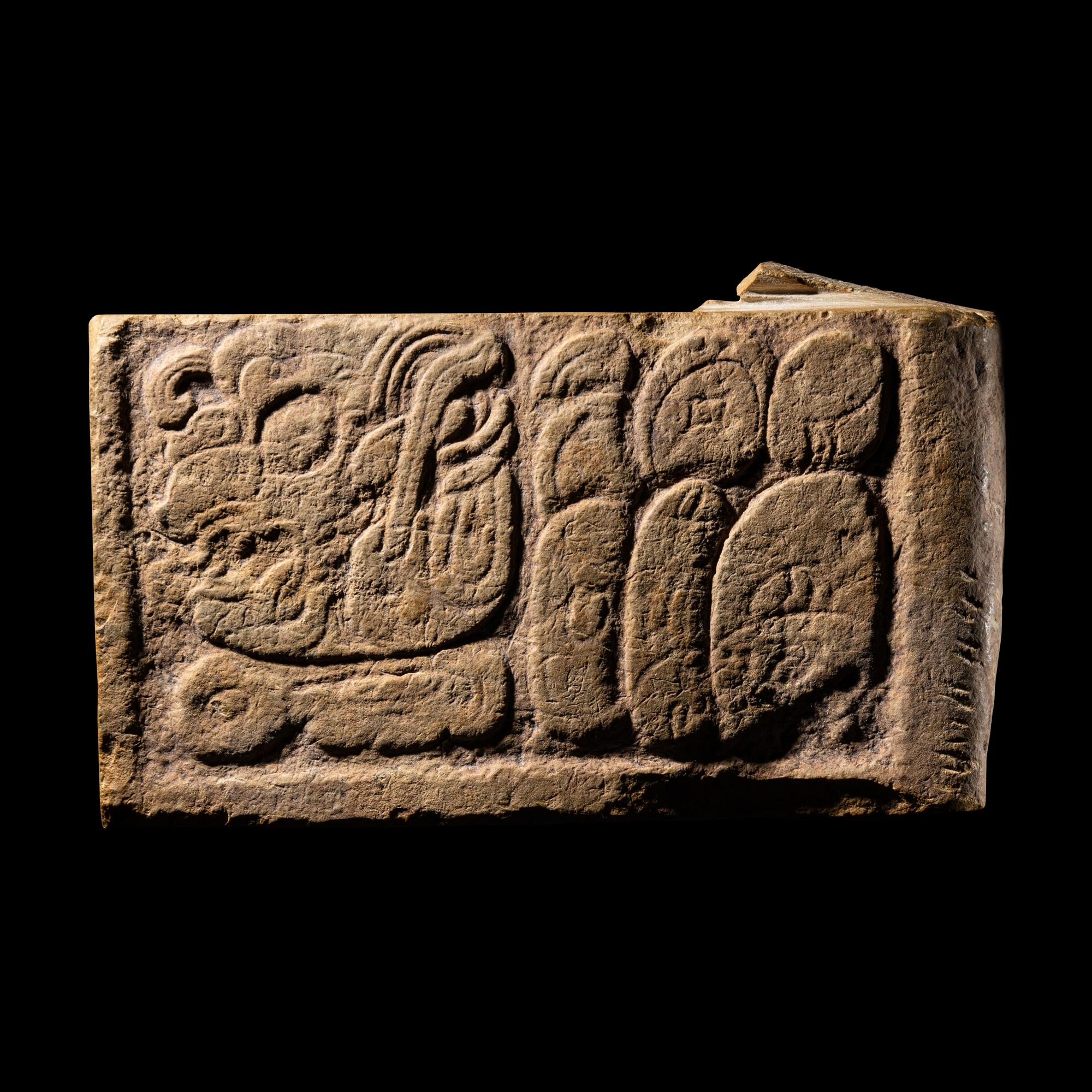 A Maya Limestone Panel with Glyphs