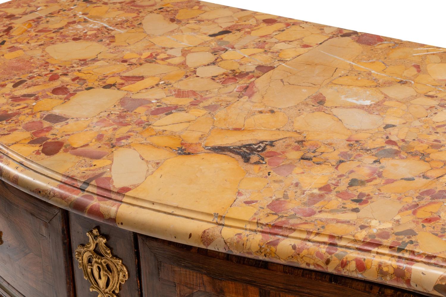 A Régence Gilt Bronze Mounted Tulipwood and Parquetry Marble-Top Commode